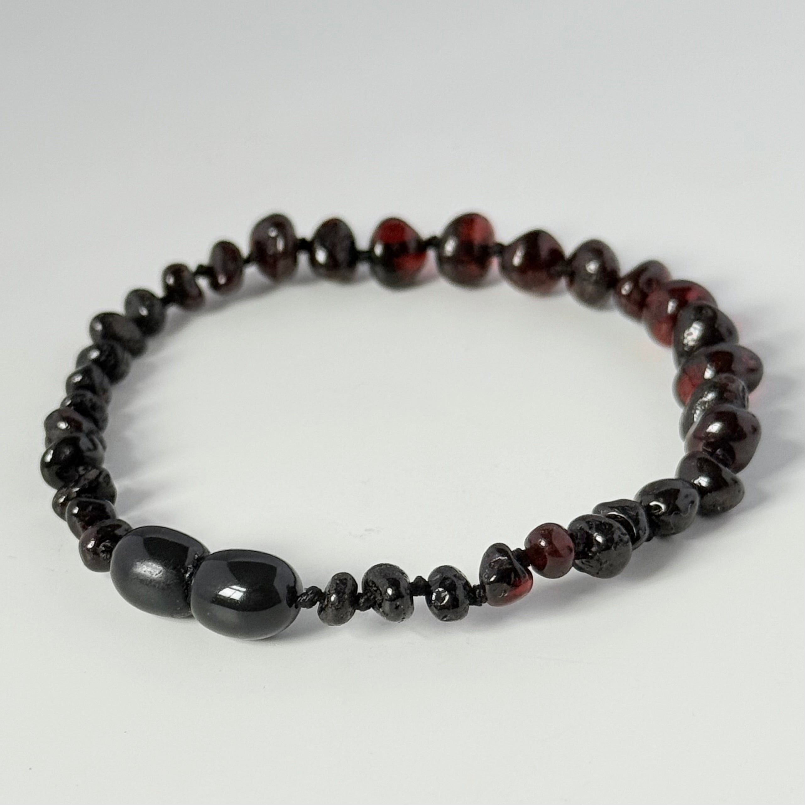 Dark Cherry and Garnet Toned Genuine Baltic Amber Baroque Stacking Bracelet with a secure screw mechanism