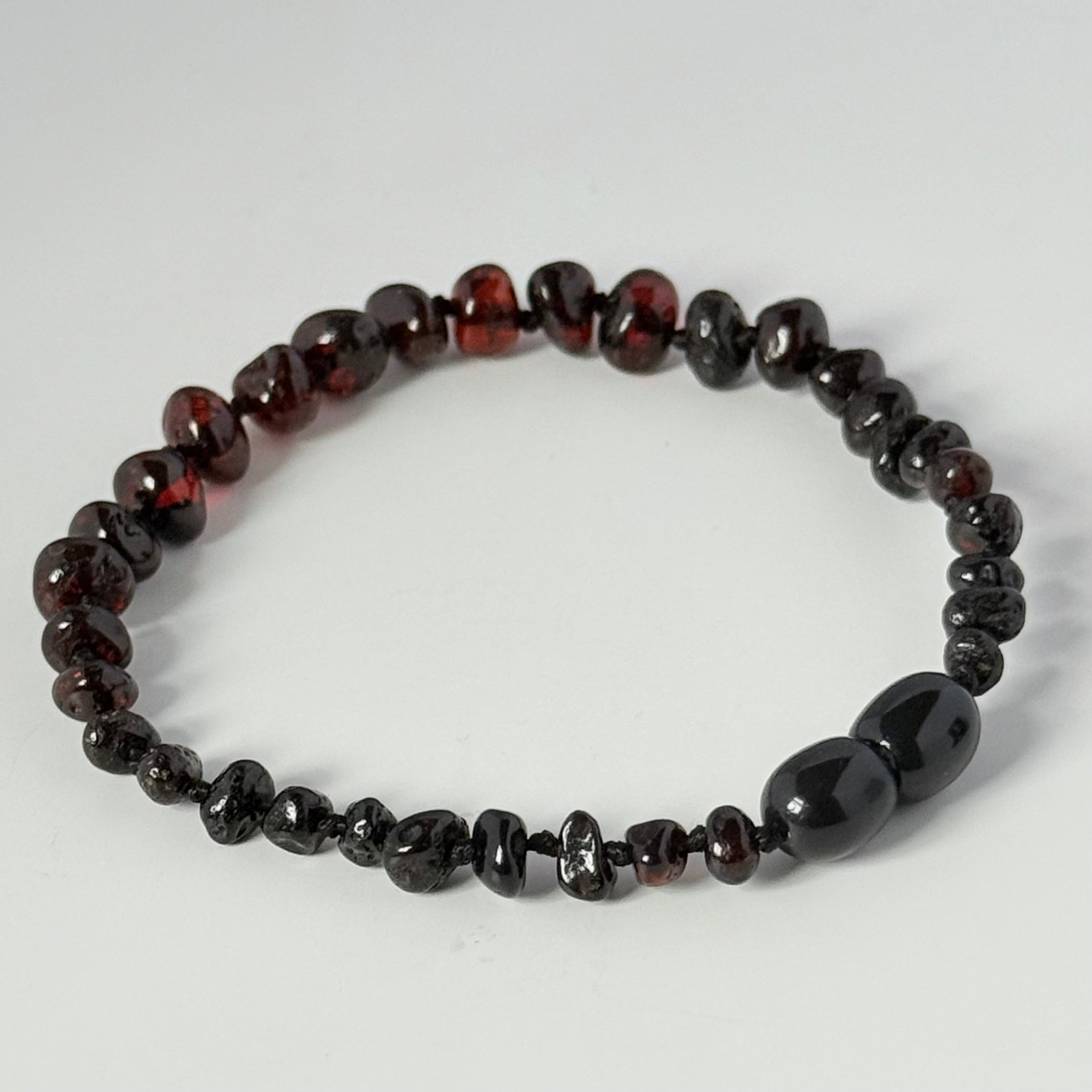 Dark Cherry and Garnet Toned Genuine Baltic Amber Baroque Stacking Bracelet with a secure screw mechanism