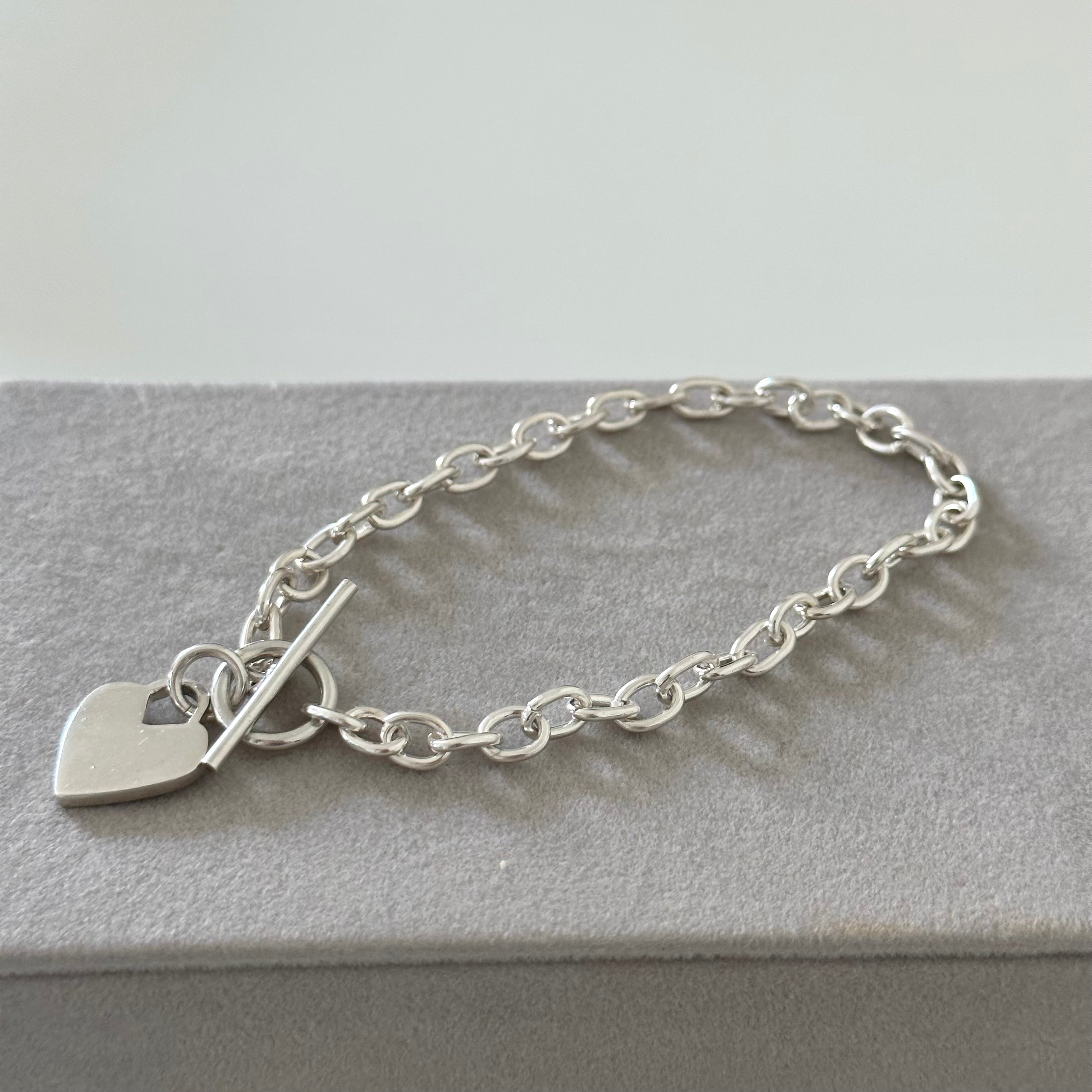 Sterling Silver Bracelet with Fine Oval Links and a Heart Charm