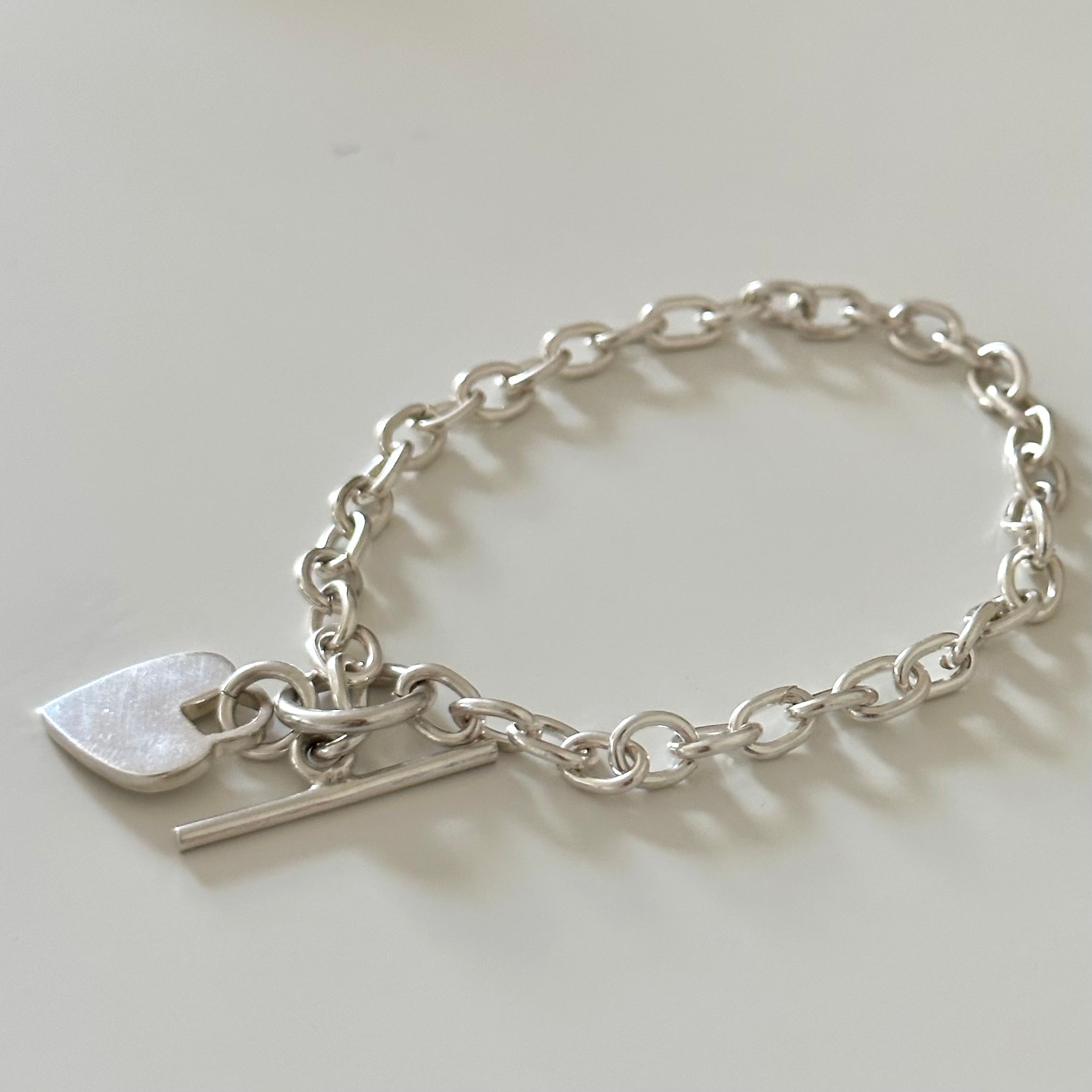 Sterling Silver Bracelet with Fine Oval Links and a Heart Charm