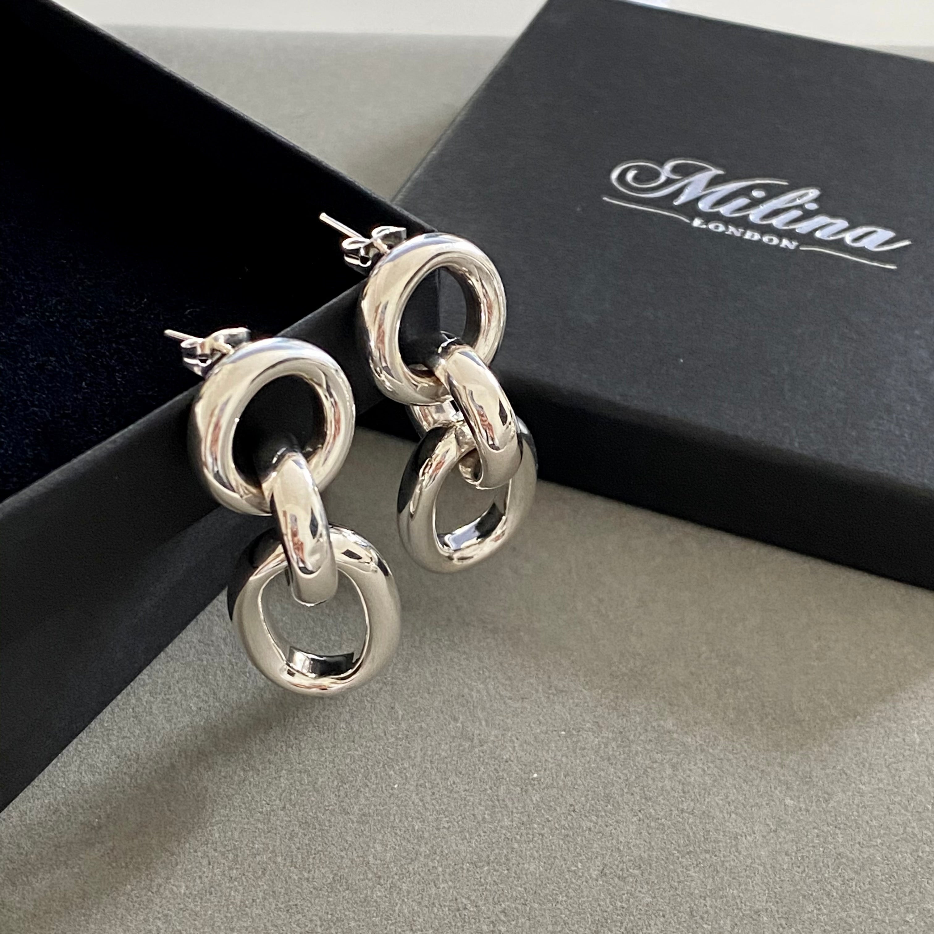 Three Small Interlinked Sterling Silver Oval Hoop Earrings