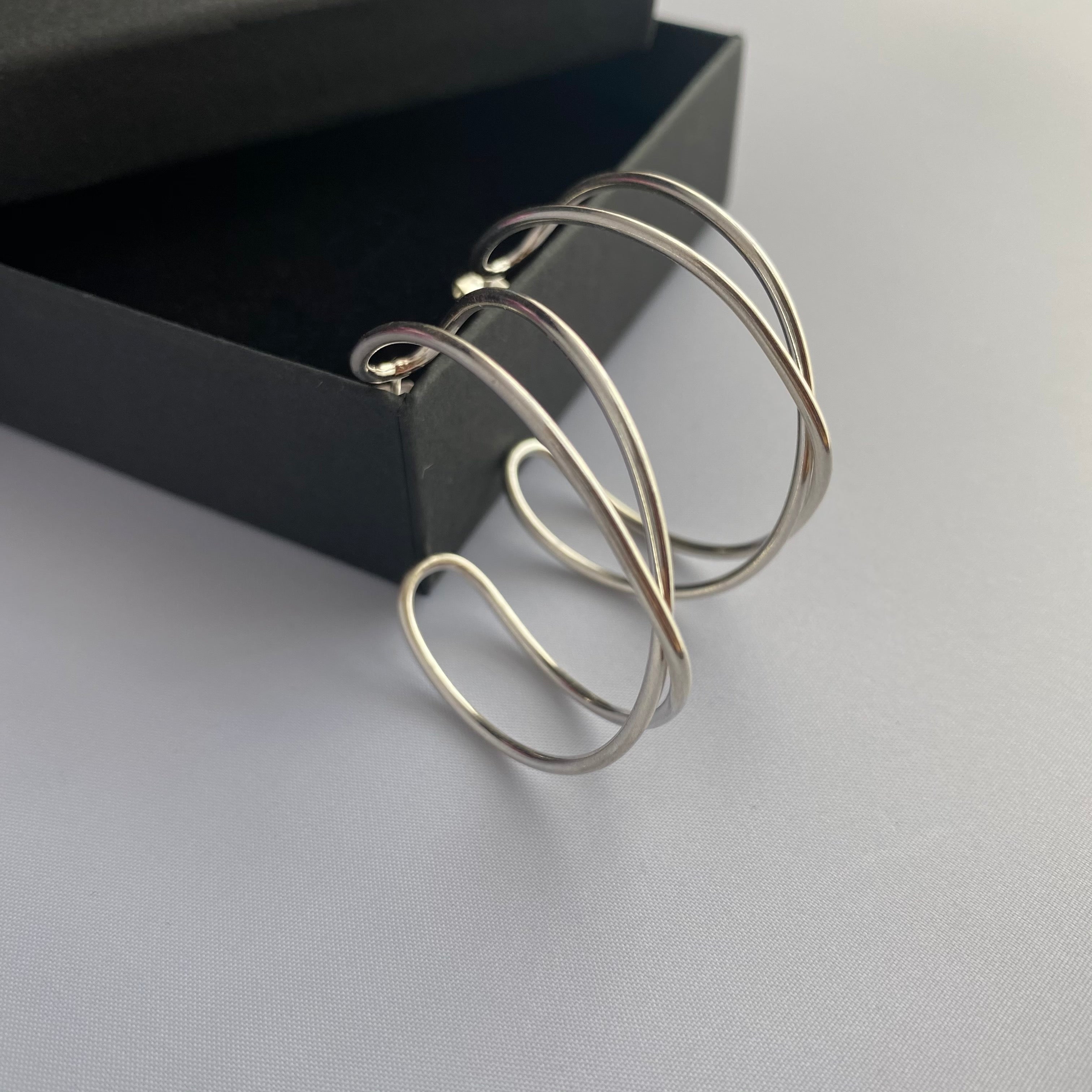 Sterling Silver Intertwined Hoop Earrings