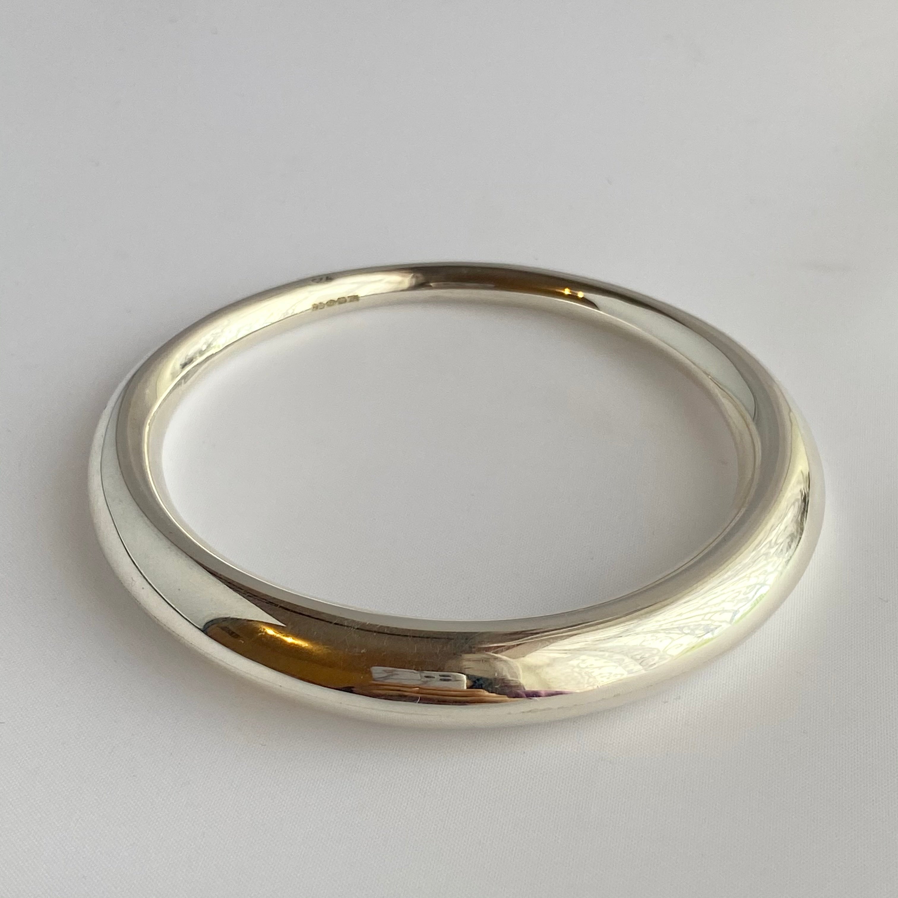 Chunky Silver Round Bangle with a Graduated Tapered Design