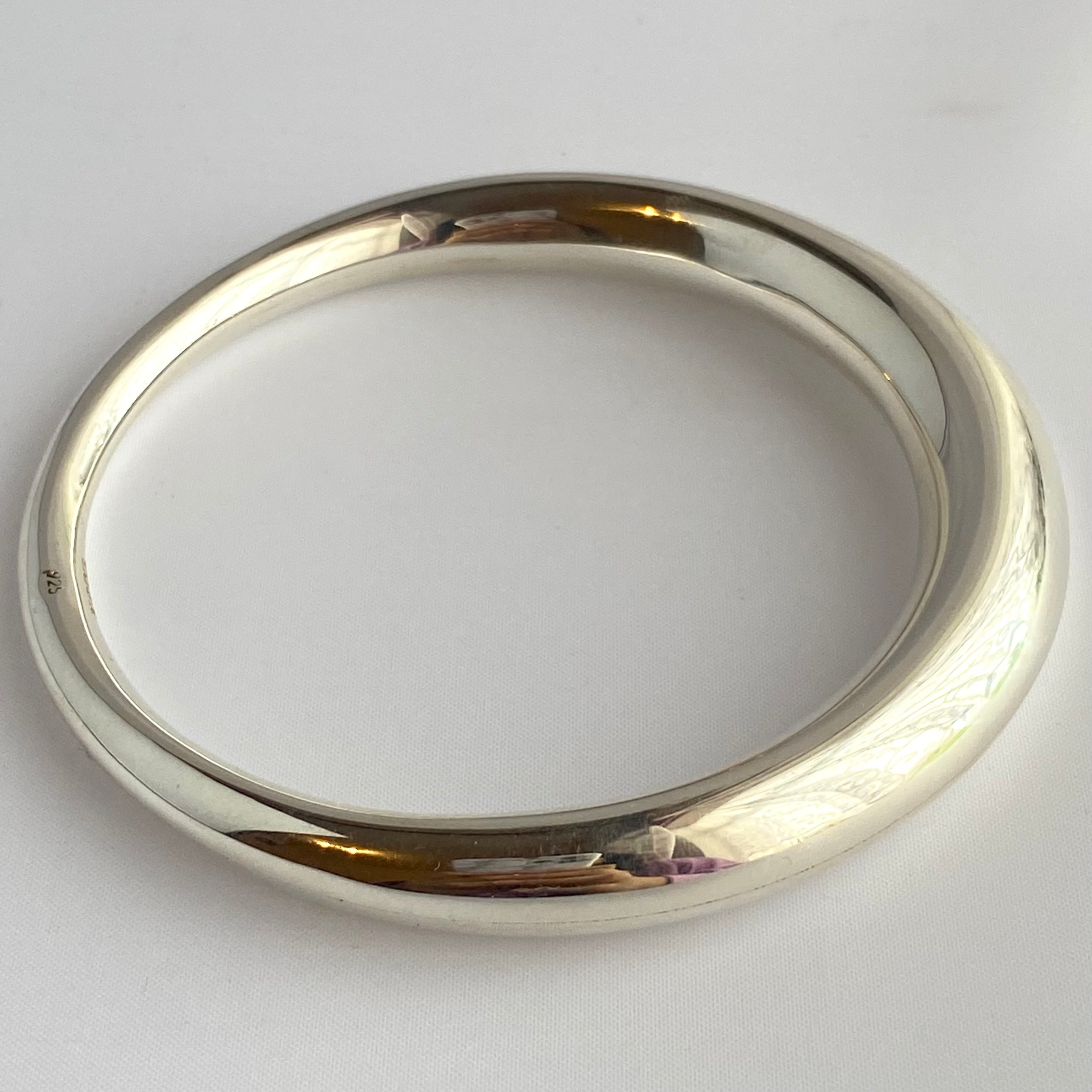 Chunky Silver Round Bangle with a Graduated Tapered Design